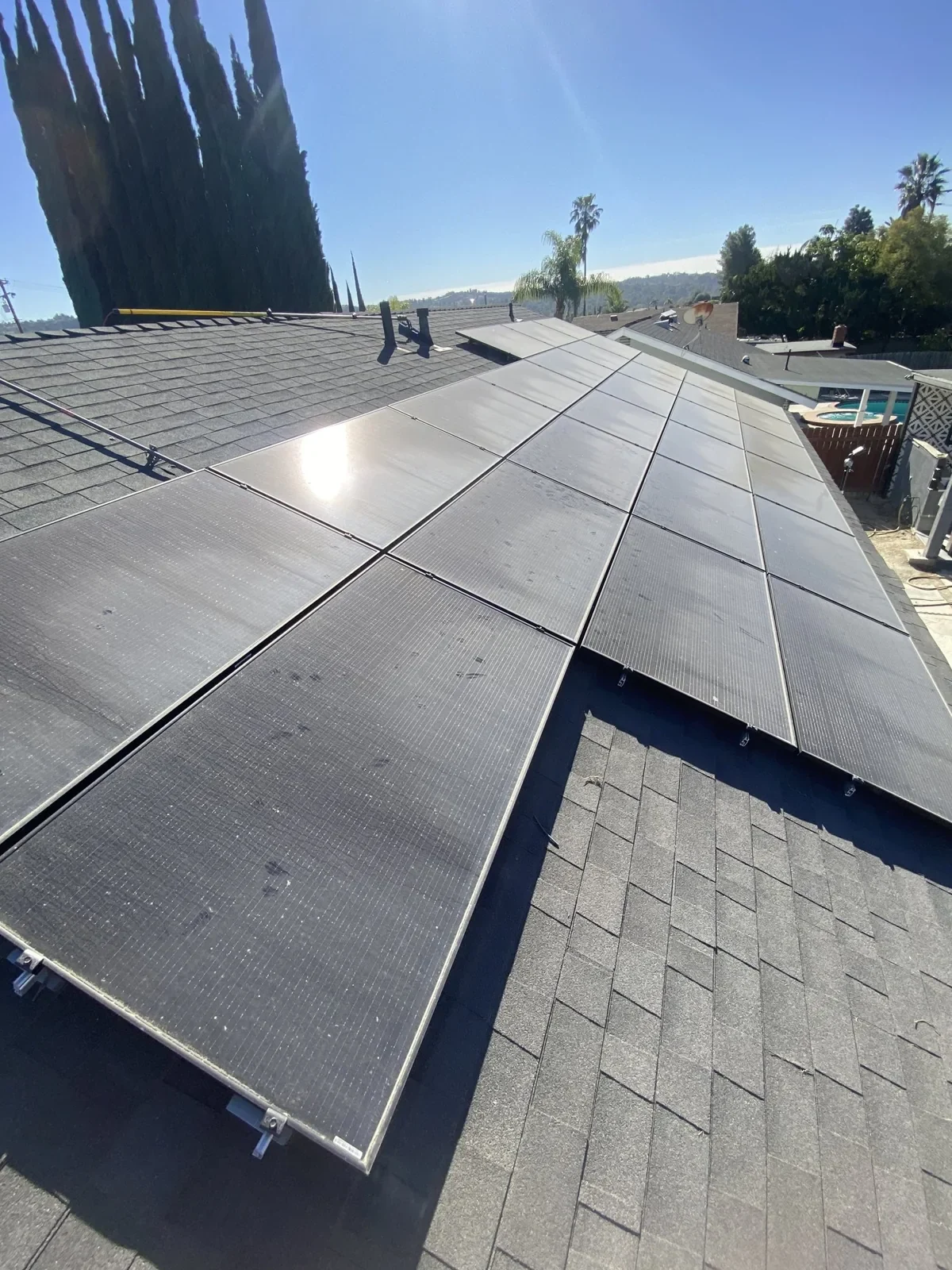 The same solar panels before cleaning, covered with accumulated dirt